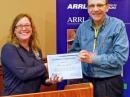 FEMA Region III Emergency Communication Coordinator Jamy Lomento receives a Certificate of Appreciation from Delaware Section Manager Bill Duveneck, KB3KYH [Herb Quick, KF3BT, photo]